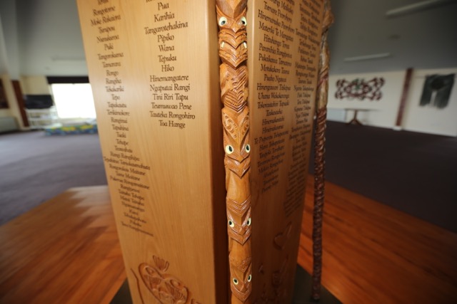A specially carved pole in the Moroni meeting house on Chatham Island is inscribed with the names of the victims of the 19th Century massacre.