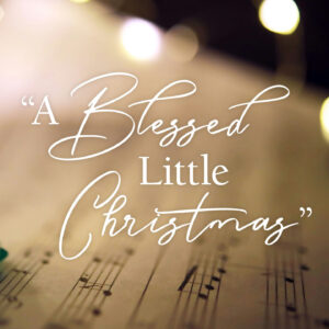 "A Blessed Little Christmas" over a music sheet