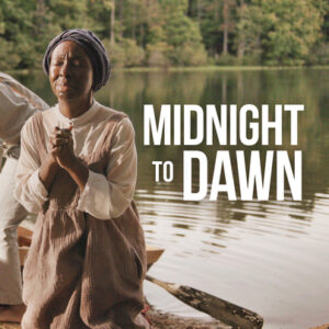 "Midnight to Dawn" beside a woman praying in front of a lake